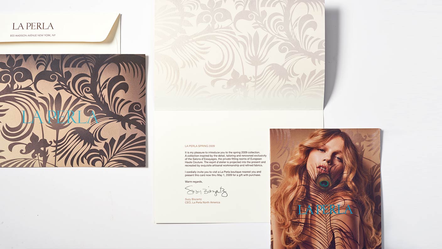 Envelope and inside and outside of a La Perla direct mail piece featuring a brown and gold pattern and the image of a blonde model posing with a peacock feather